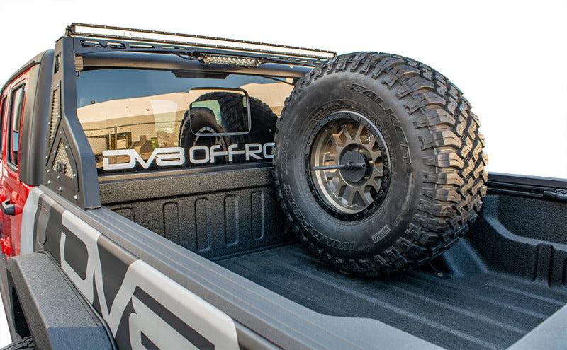 Load image into Gallery viewer, DV8 Offroad 2019+ Jeep Gladiator Universal Stand Up In-Bed Tire Carrier
