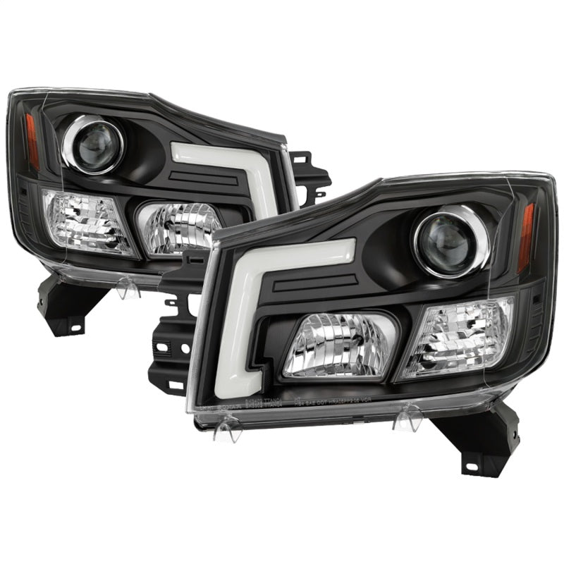 Load image into Gallery viewer, Spyder 04-15 Nissan Titan / 04-07 Nissan Armada V2 Projector Headlights - Black PRO-YD-NTI04-DRL-BK
