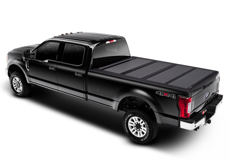 Load image into Gallery viewer, BAK 08-16 Ford Super Duty 6ft 9in Bed BAKFlip MX4 Matte Finish
