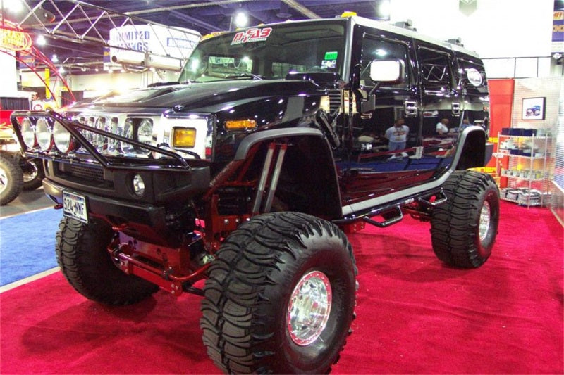 Load image into Gallery viewer, N-Fab Nerf Step 03-10 Hummer H2 SUV 4 Door - Gloss Black - W2W - 3in
