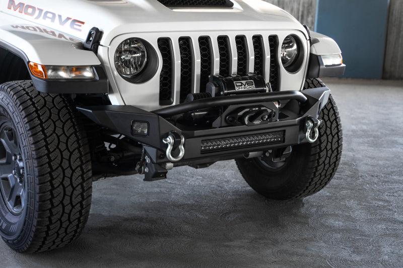 Load image into Gallery viewer, DV8 Offroad 18-23 Jeep Wrangler JL / 20-23 Jeep Gladiator JT FS-7 Mid-Width Winch Front Bumper
