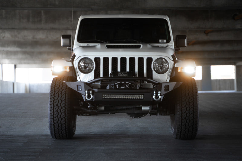 Load image into Gallery viewer, DV8 Offroad 18-23 Jeep Wrangler JL / 20-23 Jeep Gladiator JT FS-7 Mid-Width Winch Front Bumper
