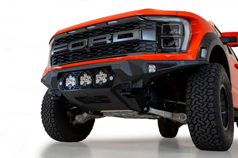 Load image into Gallery viewer, Addictive Desert Designs 2021+ Ford Raptor Bomber Front Bumper w/ 3 Baja Designs LP6 Light Mounts
