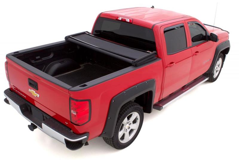 Load image into Gallery viewer, Lund 14-17 Chevy Silverado 1500 (6.5ft. Bed) Genesis Elite Tri-Fold Tonneau Cover - Black

