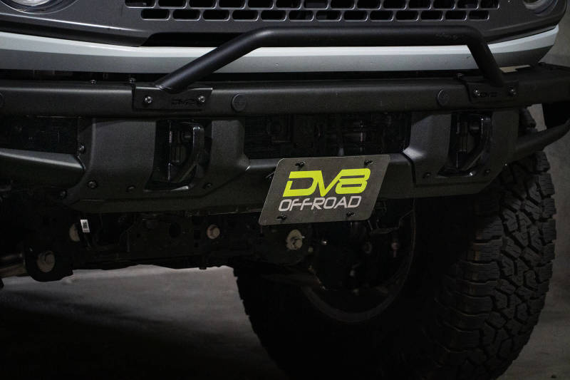 Load image into Gallery viewer, DV8 Offroad 21-22 Ford Bronco Factory Front Bumper Licence Relocation Bracket - Front
