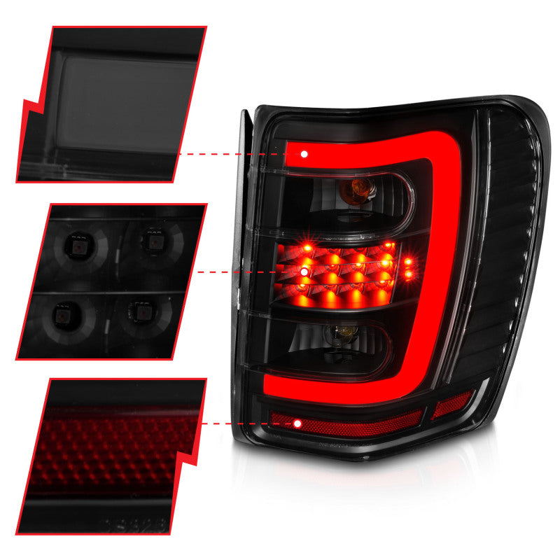 Load image into Gallery viewer, ANZO 1999-2004 Jeep Grand Cherokee LED Tail Lights w/ Light Bar Black Housing Smoke Lens
