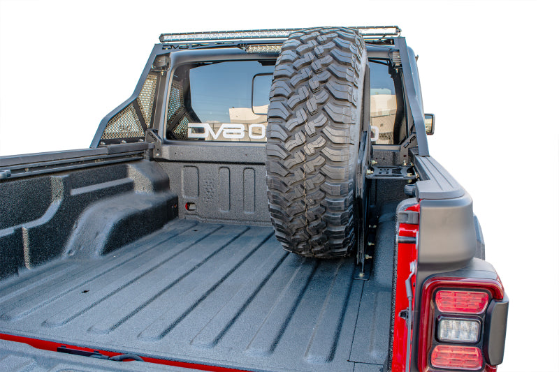 Load image into Gallery viewer, DV8 Offroad 2019+ Jeep Gladiator Universal Stand Up In-Bed Tire Carrier
