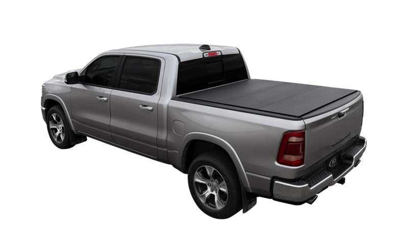 Load image into Gallery viewer, Access LOMAX Tri-Fold Cover Black Urethane Split Rail 19+ Ram 1500 - 6ft 4in Bed (w/o RamBox)
