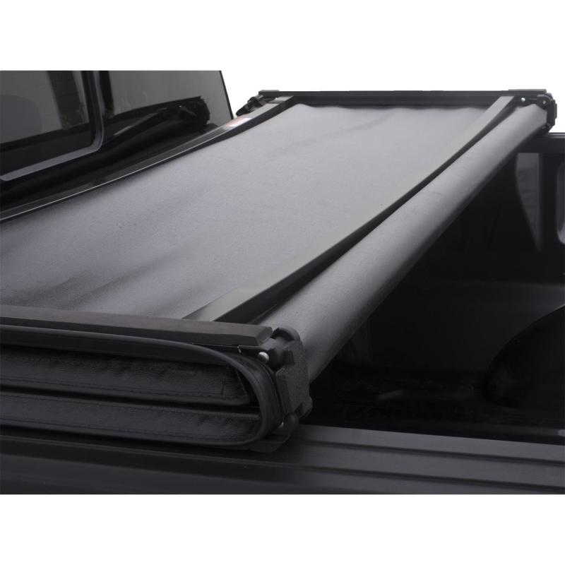 Load image into Gallery viewer, Lund 07-13 Chevy Silverado 1500 (5.5ft. Bed) Genesis Tri-Fold Tonneau Cover - Black
