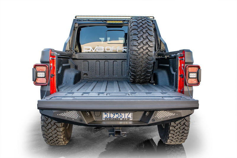 Load image into Gallery viewer, DV8 Offroad 2019+ Jeep Gladiator Universal Stand Up In-Bed Tire Carrier
