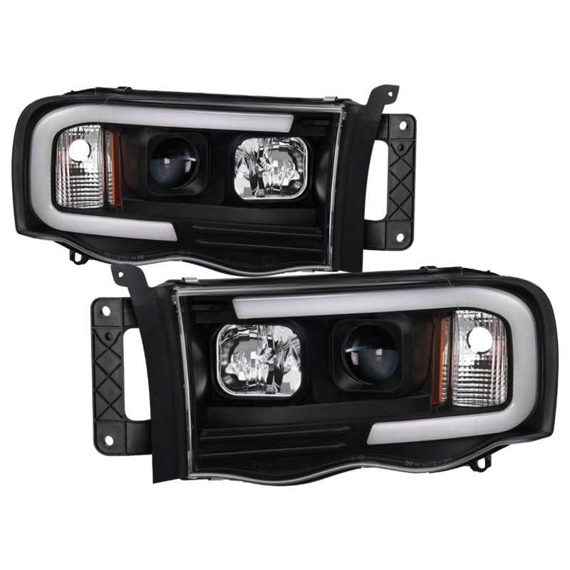 Load image into Gallery viewer, Spyder 02-05 Dodge Ram 1500 Light Bar Projector Headlights - Black (PRO-YD-DR02V2-LB-BK)
