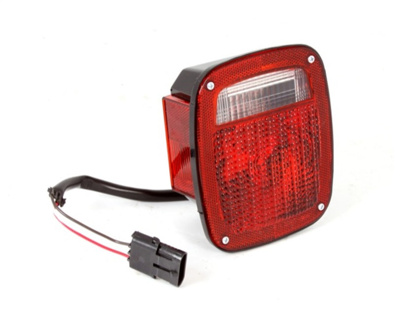 Load image into Gallery viewer, Omix Tail Light Black Housing LH 87-90 Jeep Wrangler

