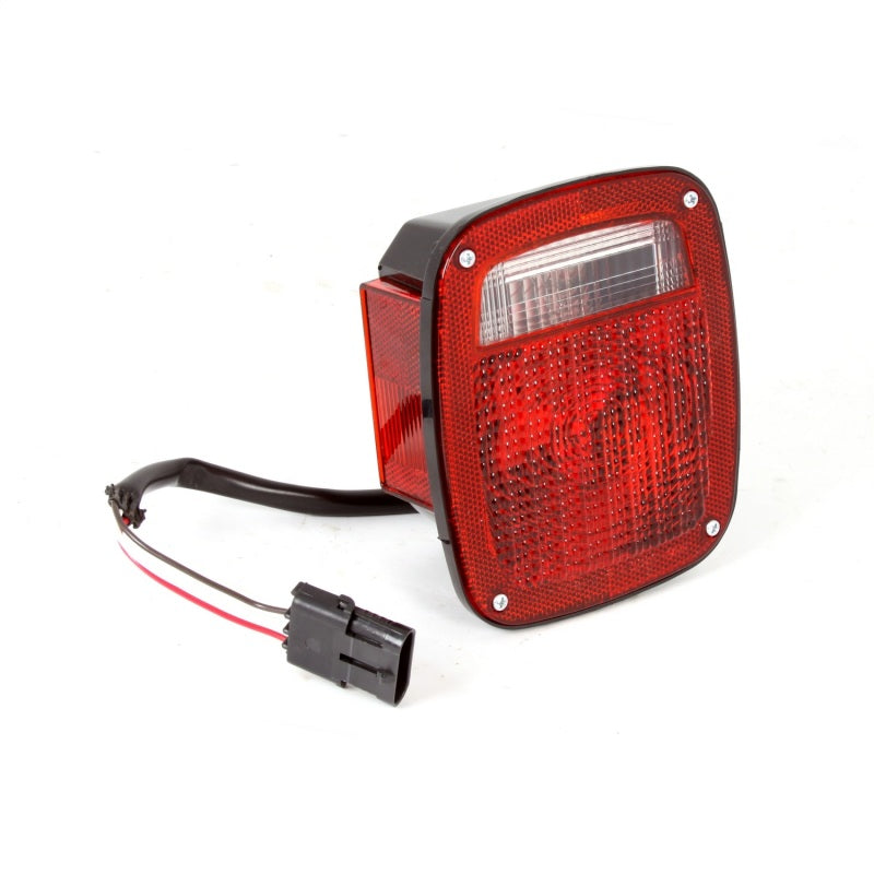Load image into Gallery viewer, Omix Tail Light LH 98-06 Jeep Wrangler TJ
