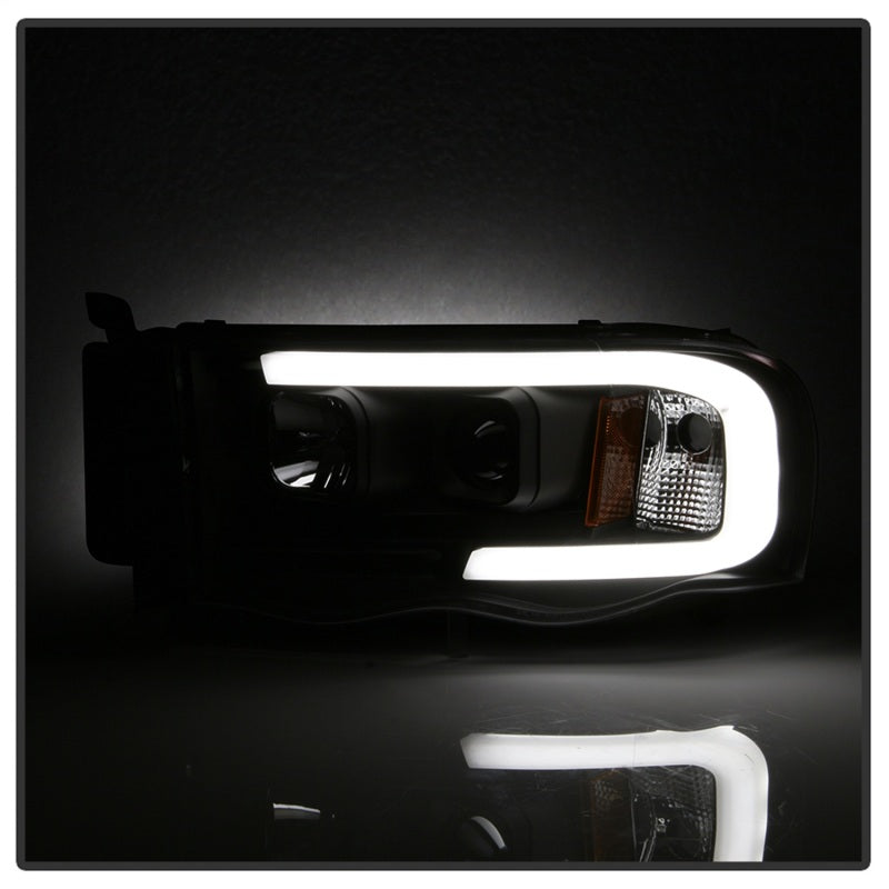 Load image into Gallery viewer, Spyder 02-05 Dodge Ram 1500 Light Bar Projector Headlights - Black (PRO-YD-DR02V2-LB-BK)
