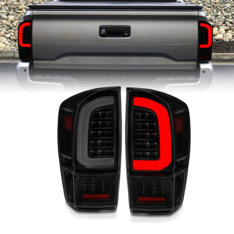 Load image into Gallery viewer, ANZO 16-21 Toyota Tacoma LED Tail Lights - w/ Light Bar Sequential Black Housing &amp; Smoke Lens
