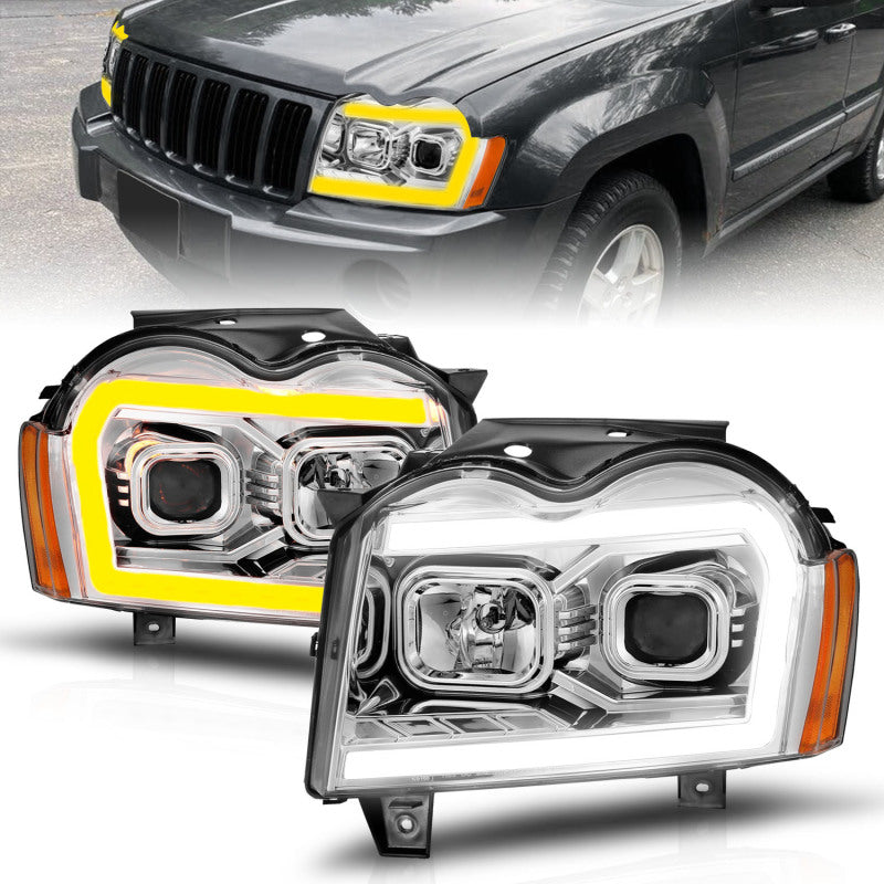 Load image into Gallery viewer, ANZO 05-07 Jeep Grand Cherokee Projector Headlights - w/ Light Bar Switchback Chrome Housing
