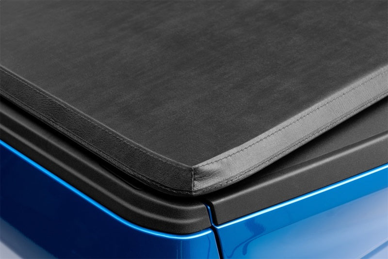 Load image into Gallery viewer, Lund 15-18 Ford F-150 (5.5ft. Bed) Genesis Tri-Fold Tonneau Cover - Black
