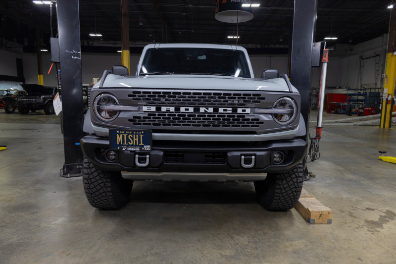 Load image into Gallery viewer, Mishimoto 2022+ Ford Bronco Capable Bumper License Plate Relocation
