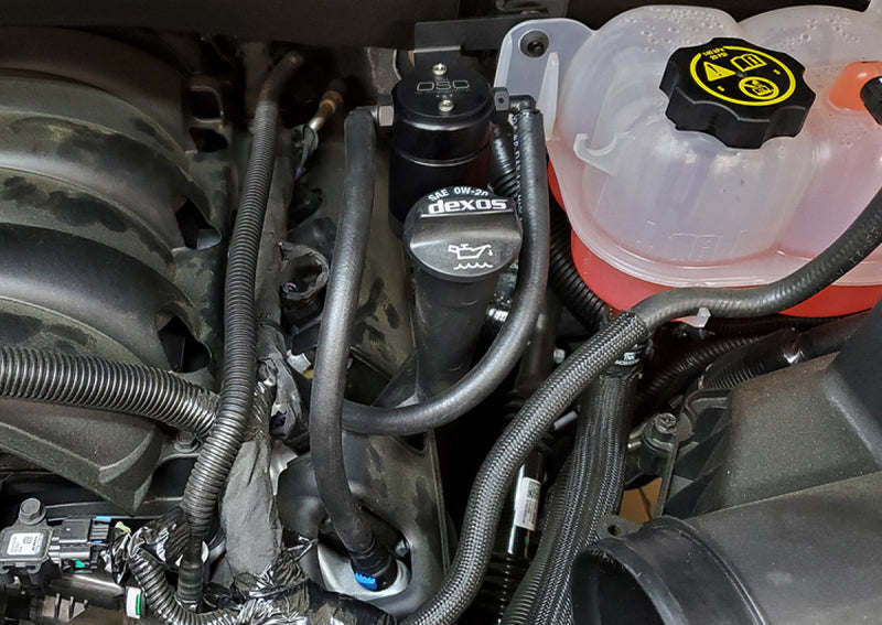 Load image into Gallery viewer, J&amp;L 19-26 Chevrolet Silverado/GMC Sierra 1500 5.3L V8 Driver Side Oil Separator 3.0 - Black Anod
