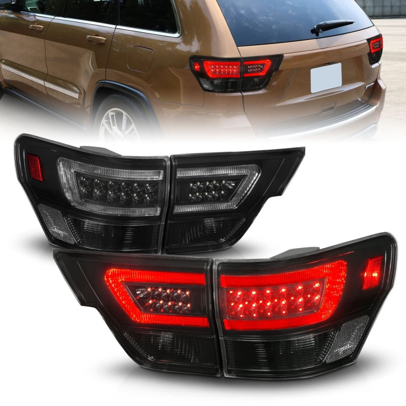 Load image into Gallery viewer, ANZO 11-13 Jeep Grand Cherokee LED Taillights w/ Lightbar Black Housing/Smoke Lens 4pcs
