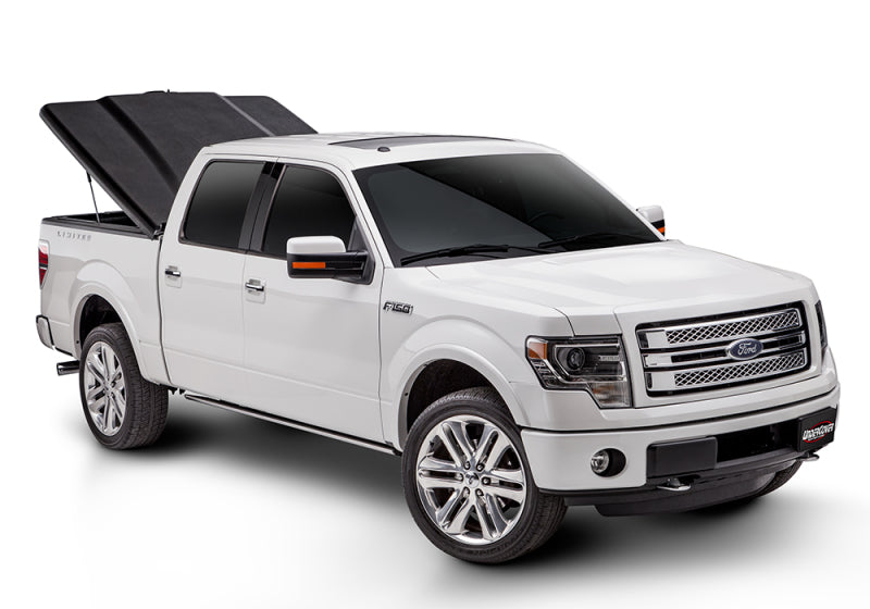 Load image into Gallery viewer, UnderCover 16-20 Toyota Tacoma 6ft Elite Bed Cover - Black Textured (Req Factory Deck Rails)
