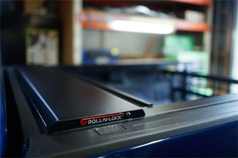 Load image into Gallery viewer, Roll-N-Lock 09-14 Ford F-150 67in E-Series Retractable Tonneau Cover
