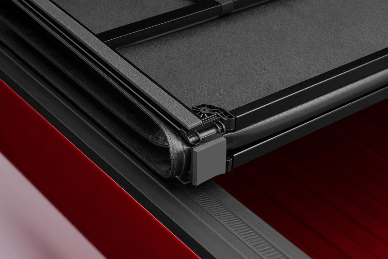 Load image into Gallery viewer, Lund 15-18 Ford F-150 Styleside (5.5ft. Bed) Hard Fold Tonneau Cover - Black
