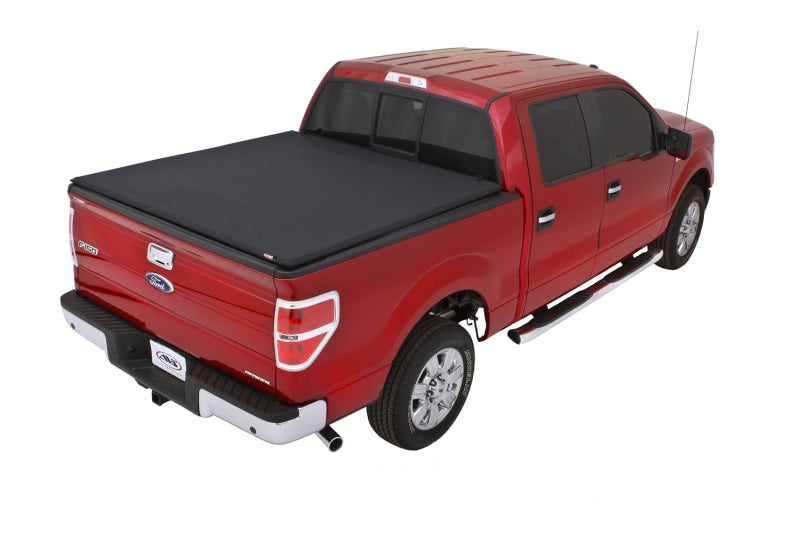 Load image into Gallery viewer, Lund 04-14 Ford F-150 (5.5ft. Bed) Genesis Elite Tri-Fold Tonneau Cover - Black
