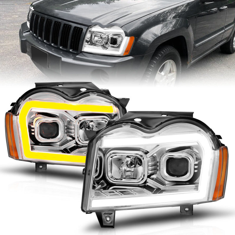 Load image into Gallery viewer, ANZO 05-07 Jeep Grand Cherokee Projector Headlights - w/ Light Bar Switchback Chrome Housing
