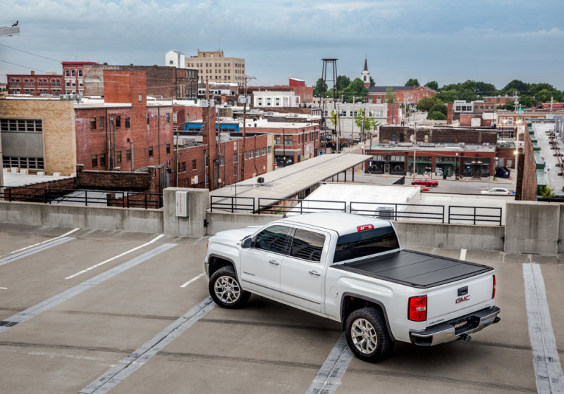 Load image into Gallery viewer, UnderCover 07-13 Chevy Silverado 1500/2500 HD 6.5ft Ultra Flex Bed Cover - Matte Black Finish
