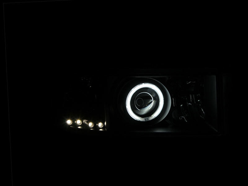 Load image into Gallery viewer, ANZO 1994-2001 Dodge Ram Projector Headlights w/ Halo Black
