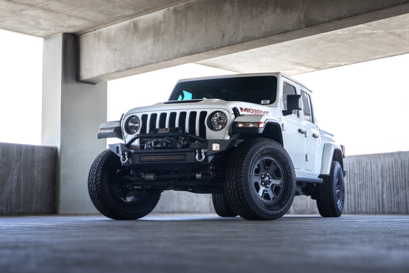 Load image into Gallery viewer, DV8 Offroad 18-23 Jeep Wrangler JL / 20-23 Jeep Gladiator JT FS-7 Mid-Width Winch Front Bumper
