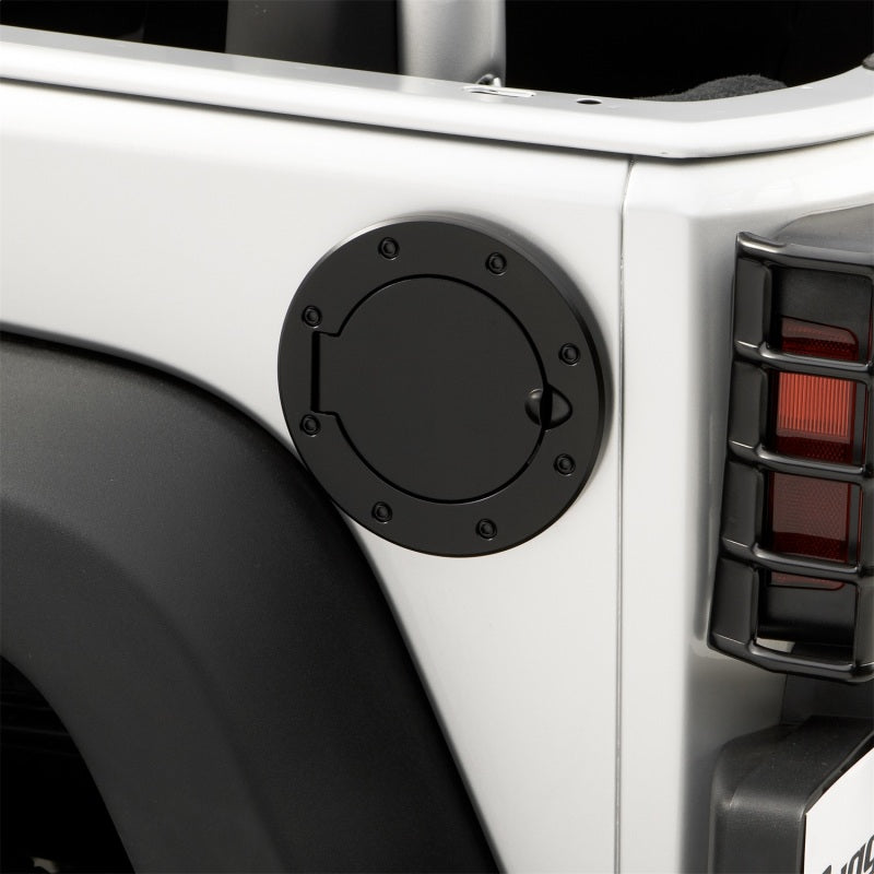 Load image into Gallery viewer, Rugged Ridge 07-18 Jeep Wrangler JK Black Non-Locking Gas Cap Door
