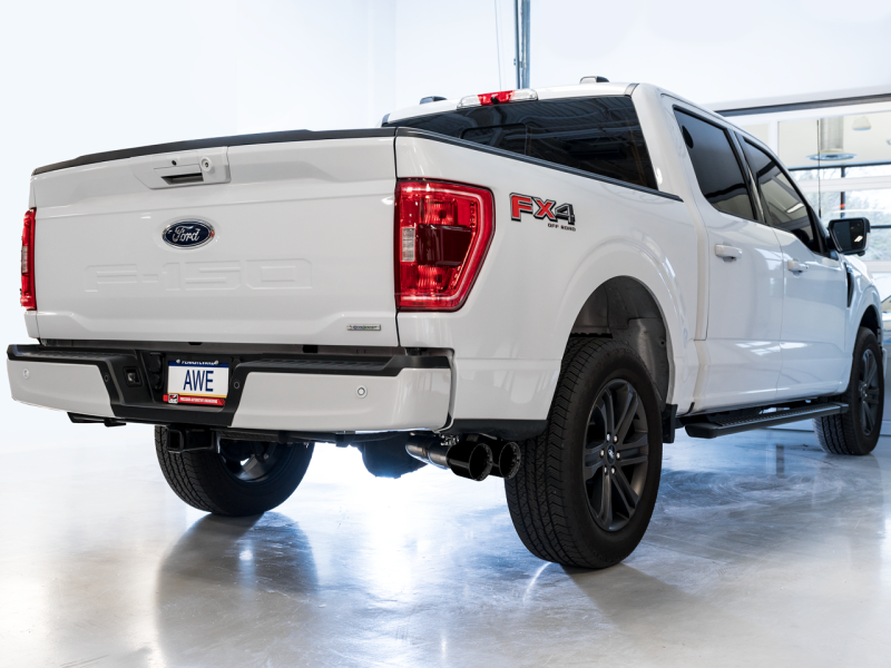 Load image into Gallery viewer, AWE 21+ Ford F150 Dual Side Exit Cat-Back Exhaust - 4.5in Diamond Black Tips *For Stock Y-Pipe Only
