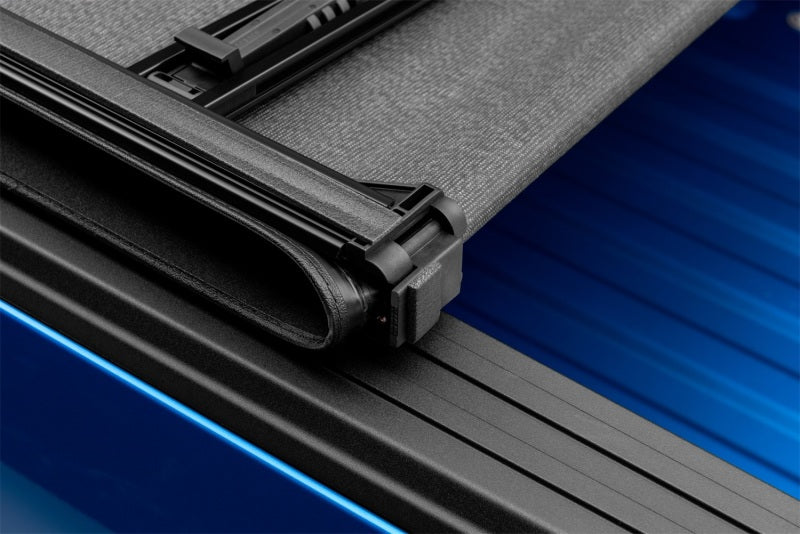 Load image into Gallery viewer, Lund 02-17 Dodge Ram 1500 (6.5ft. Bed Excl. Rambox) Genesis Elite Tri-Fold Tonneau Cover - Black
