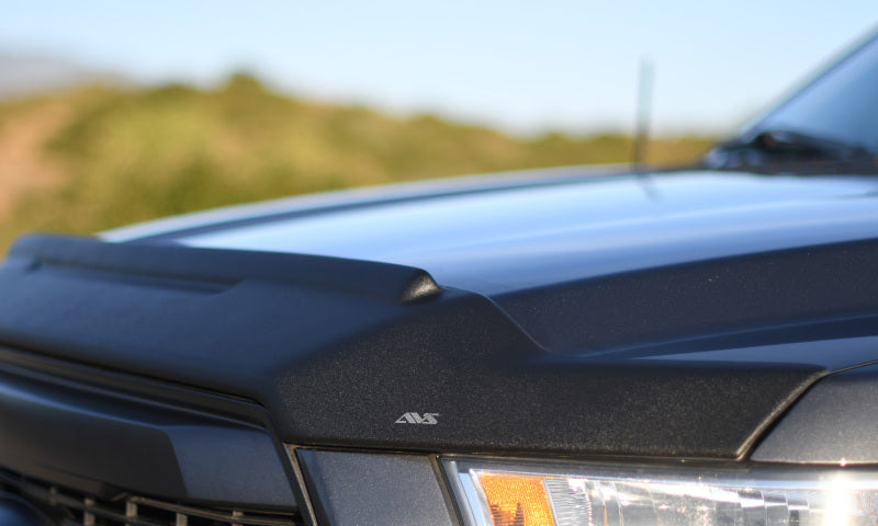 Load image into Gallery viewer, AVS 04-15 Nissan Titan Aeroskin II Textured Low Profile Hood Shield - Black
