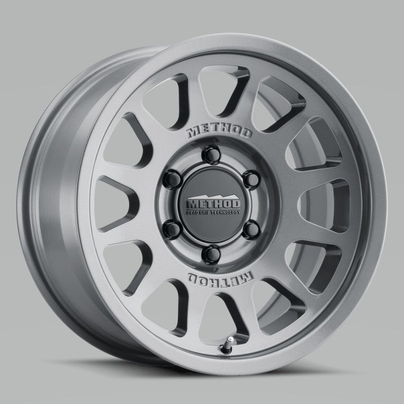 Load image into Gallery viewer, Method MR703 17x7.5 +50mm Offset 6x130 84.1mm CB Gloss Titanium Wheel
