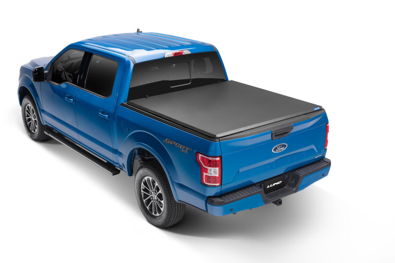 Load image into Gallery viewer, Lund 15-18 Ford F-150 Styleside (5.5ft. Bed) Hard Fold Tonneau Cover - Black
