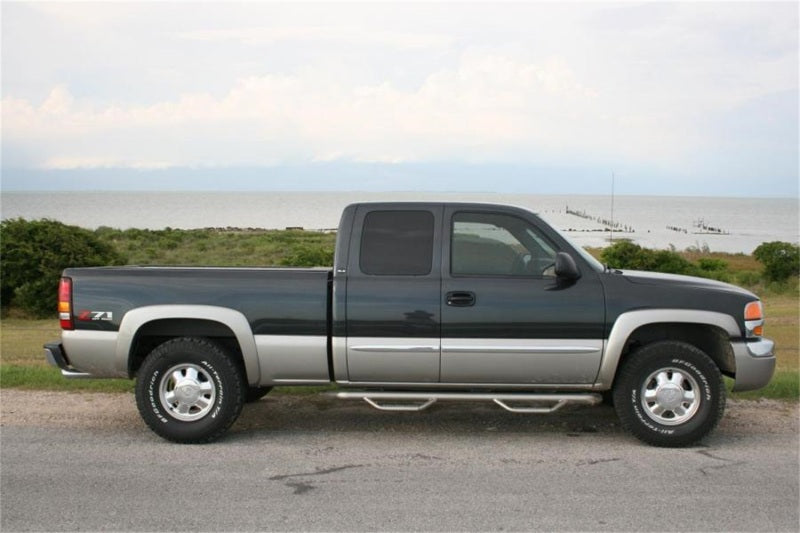 Load image into Gallery viewer, N-Fab Nerf Step 99-06 Chevy-GMC 2500/3500 Ext. Cab - Gloss Black - Cab Length - 3in
