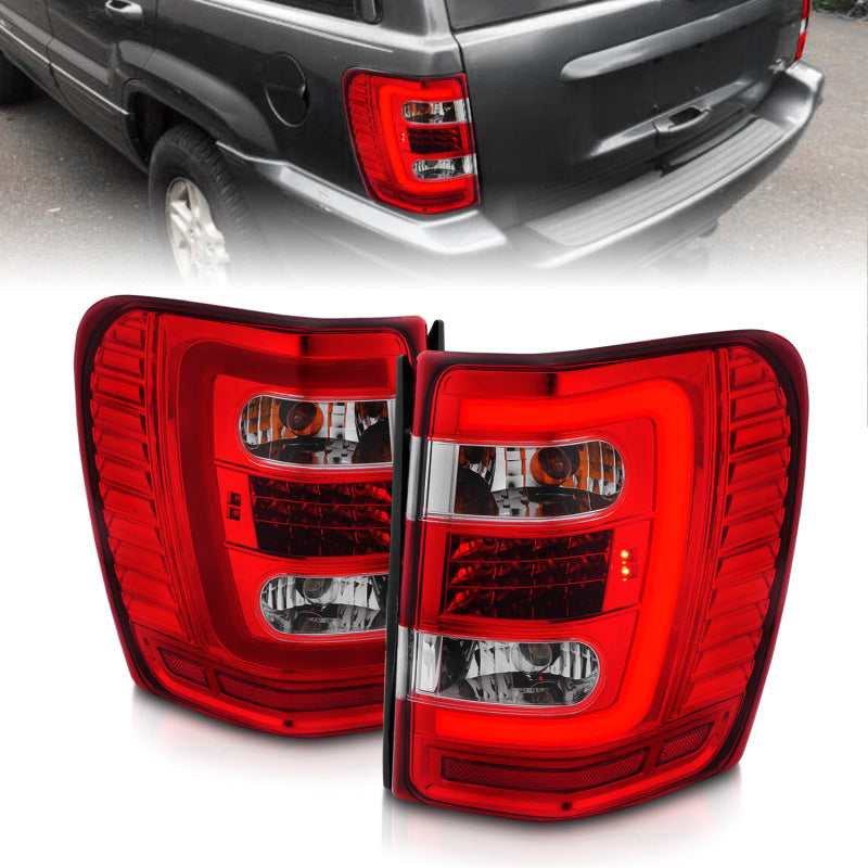 Load image into Gallery viewer, ANZO 1999-2004 Jeep Grand Cherokee LED Tail Lights w/ Light Bar Chrome Housing Red/Clear Lens
