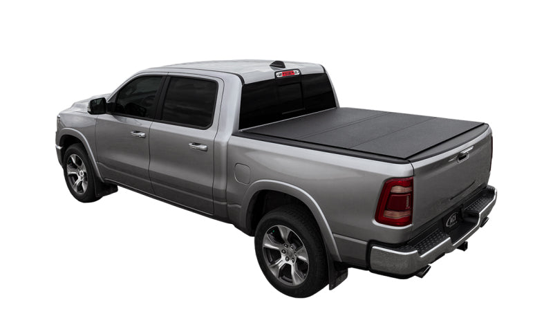 Load image into Gallery viewer, Access LOMAX Tri-Fold Cover Black Urethane Split Rail 19+ Ram 1500 - 6ft 4in Bed (w/o RamBox)
