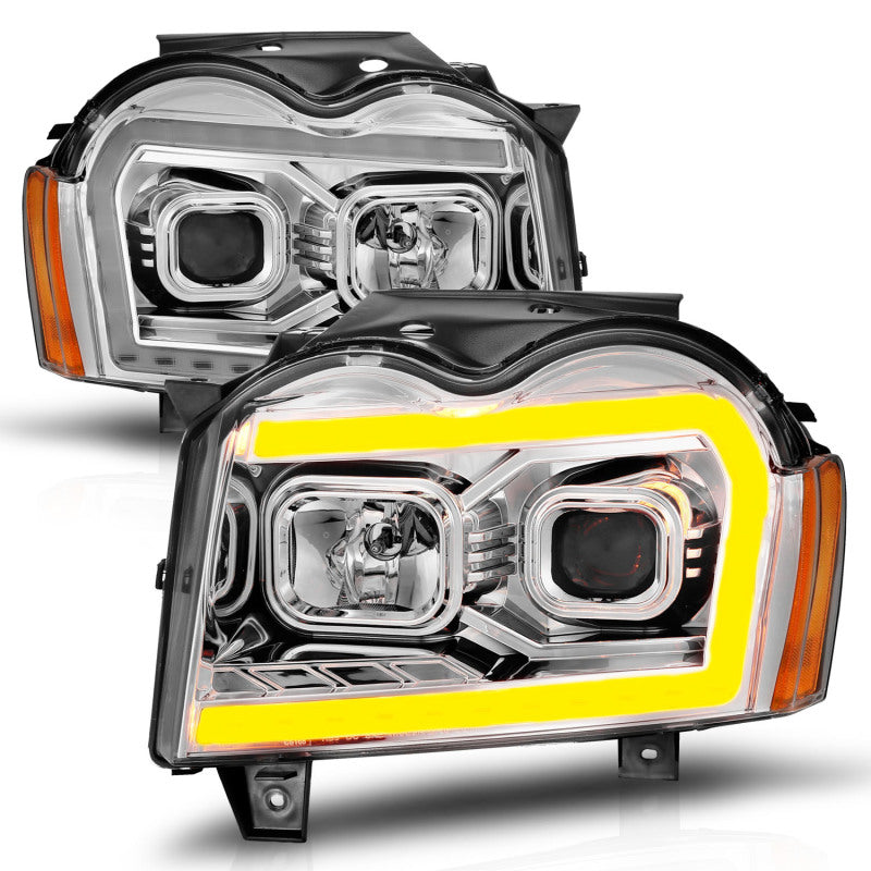 Load image into Gallery viewer, ANZO 05-07 Jeep Grand Cherokee Projector Headlights - w/ Light Bar Switchback Chrome Housing
