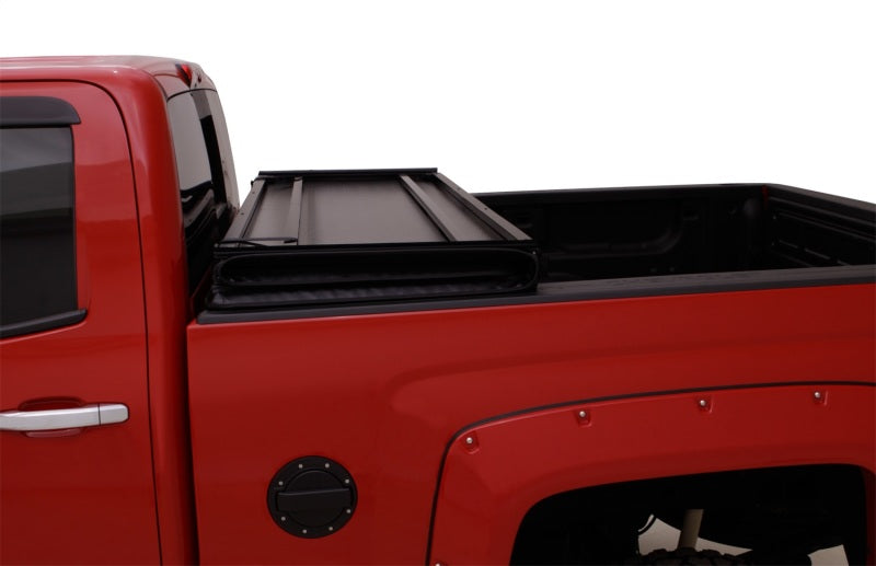 Load image into Gallery viewer, Lund 07-13 Chevy Silverado 1500 Fleetside (5.8ft. Bed) Hard Fold Tonneau Cover - Black
