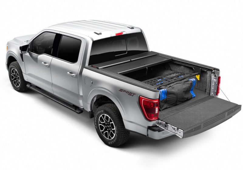 Load image into Gallery viewer, Roll-N-Lock 17-19 Ford F-250/F-350 Super Duty SB 80-3/8in Cargo Manager
