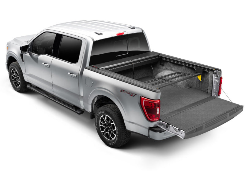Load image into Gallery viewer, Roll-N-Lock 21-22 Ford F-150 (97.6in. Bed Length) Cargo Manager
