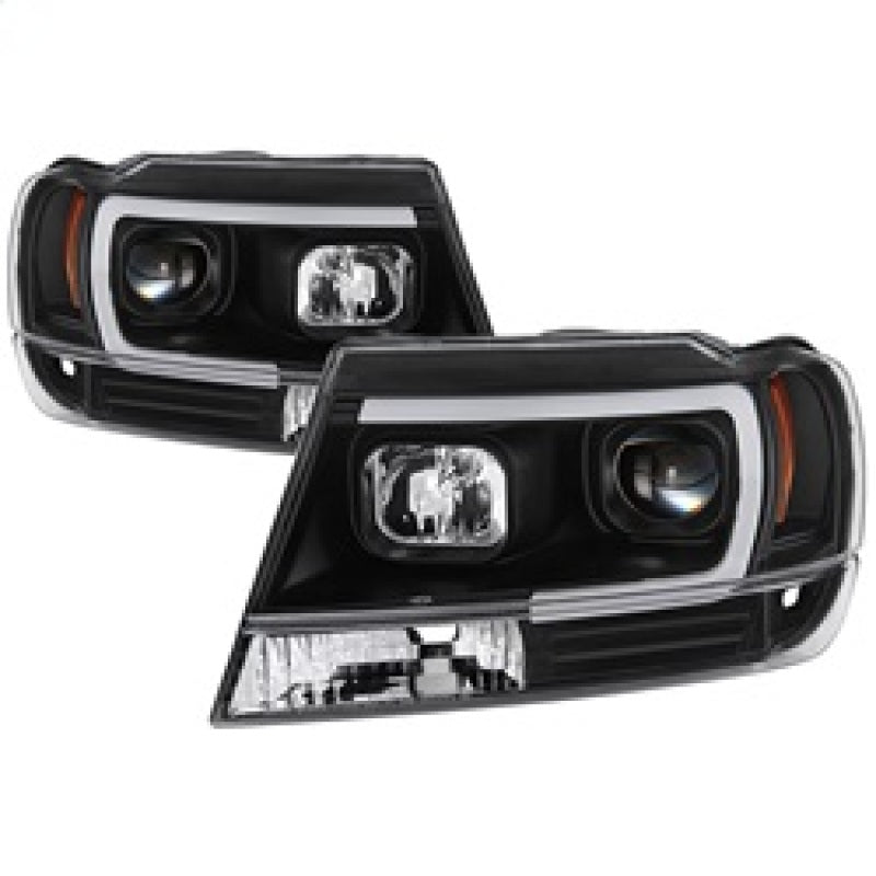 Load image into Gallery viewer, Spyder 99-04 Jeep Grand Cherokee Projector Headlights - Light Bar DRL LED - Black
