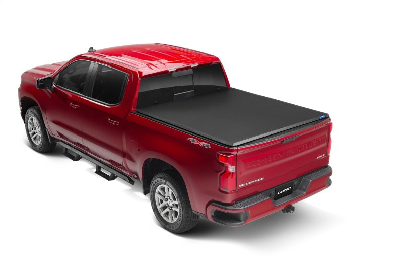 Load image into Gallery viewer, Lund 07-13 Chevy Silverado 1500 (5.5ft. Bed) Genesis Tri-Fold Tonneau Cover - Black
