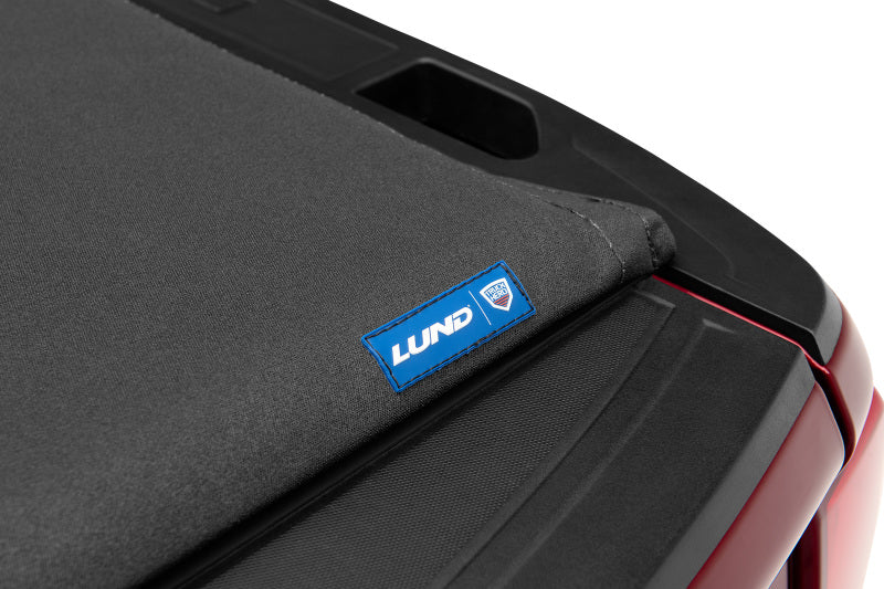 Load image into Gallery viewer, Lund 16-23 Toyota Tacoma (5ft. Bed) Hard Fold Tonneau Cover - Black
