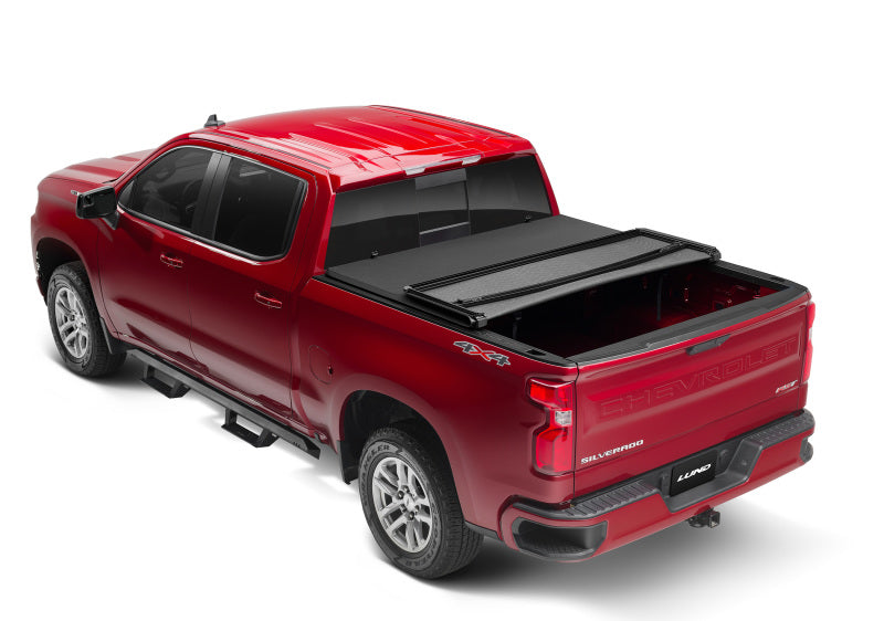 Load image into Gallery viewer, Lund 14-17 Chevy Silverado 1500 (6.5ft. Bed) Genesis Elite Tri-Fold Tonneau Cover - Black
