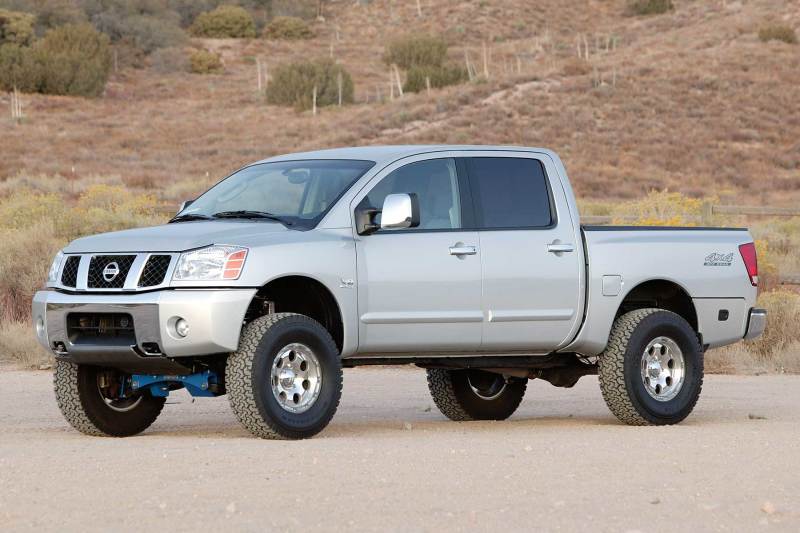 Load image into Gallery viewer, Fabtech 04-13 Nissan Titan 2/4WD 6in Basic Sys w/Perf Shks
